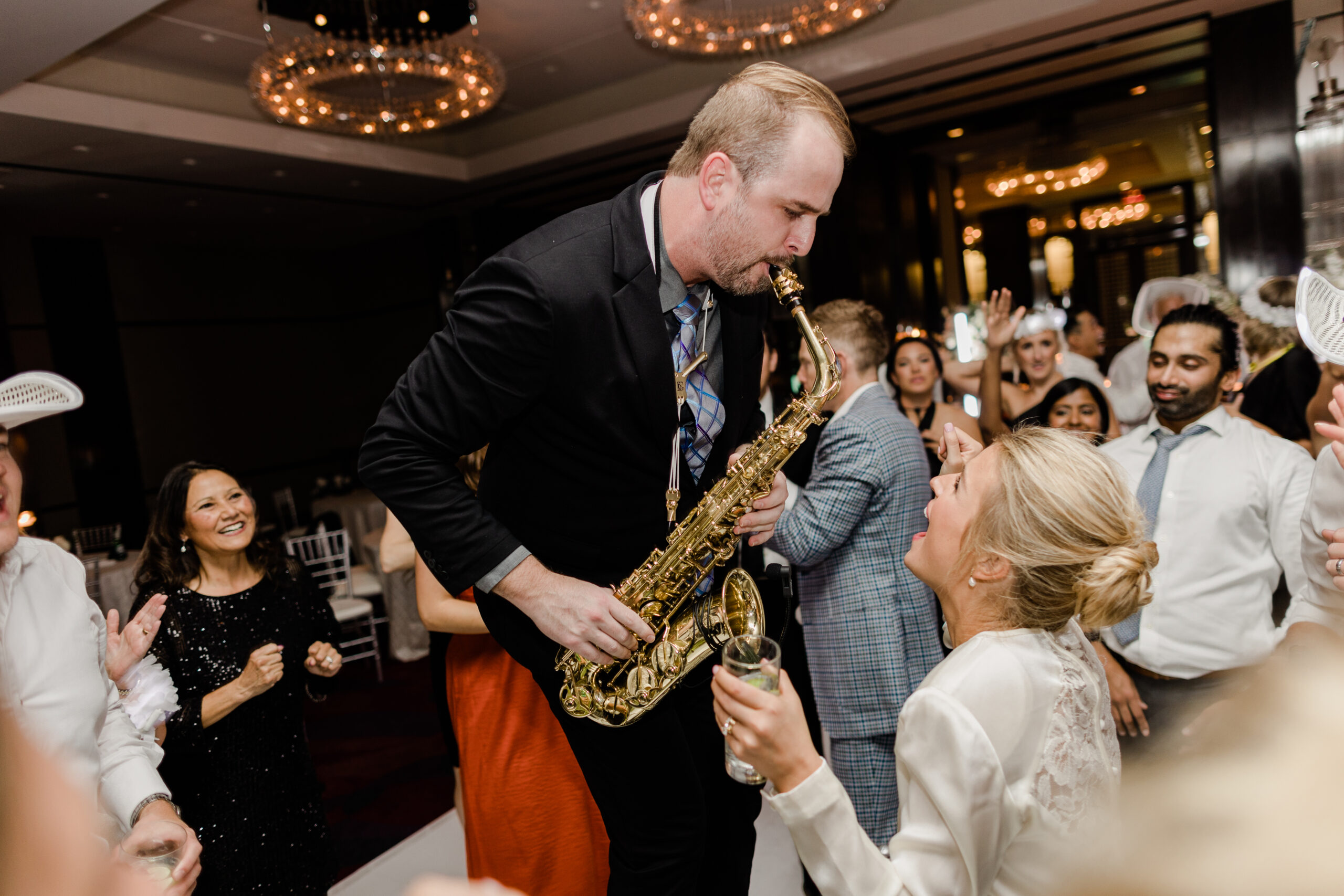 Matt Thelen performing live saxophone during a wedding reception at The Joule in Dallas
